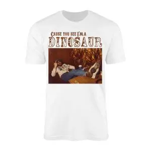 White t-shirt with a vintage photo of a cowboy reclining on a desk under Cause You See I'm A Dinosaur text