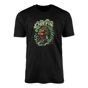 Black flat lay t-shirt with CHIEFIN text above a Native American chief in a feather headdress surrounded by green smoke