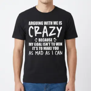 Arguing With Me Is Crazy Sarcastic T-Shirt 9 Front view of a man wearing a black graphic t-shirt with the sarcastic quote 'Arguing with me is crazy because my goal isn't to win'.