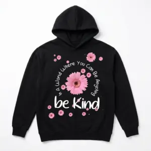 Be Kind Floral Positivity T-Shirt 7 Black t-shirt with the message "In A World Where You Can Be Anything be Kind" and pink daisy flowers, front angle.
