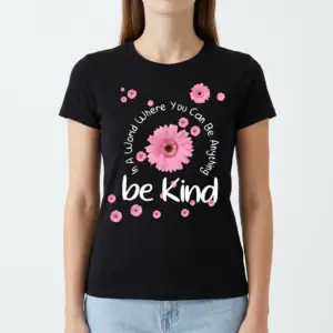 Be Kind Floral Positivity T-Shirt 9 Front view of the Mom Shirt, a black tee with the inspirational "be Kind" quote and scattered pink floral graphics.