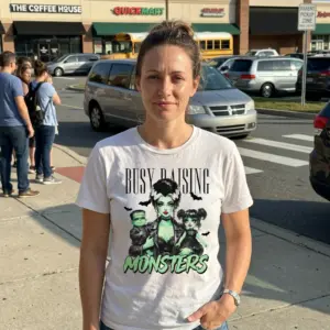 Busy Raising Monsters Halloween Mom T-Shirt 11 Halloween Mom T-Shirt in white, featuring the "Busy Raising Monsters" design with a green-skinned mother and two children.
