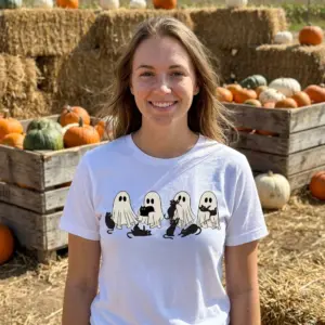Cute Ghosts and Black Cats Halloween T-Shirt 11 Model wearing Halloween T-shirt with ghost and black cat motif.