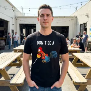 Don't Be A Sucker Rooster Pun T-Shirt 10 Lifestyle view of the Don't Be A rooster pun graphic t-shirt worn in an everyday setting.