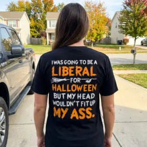 Edgy Political Halloween Liberal Sarcasm T-Shirt 11 Outdoor scene showing a person in a black t-shirt with an edgy political Halloween text.