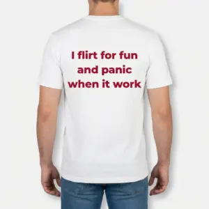 Flirt For Fun Panic Funny Dating T-Shirt 9 Back view of a male model wearing the funny dating shirt with I flirt for fun and panic when it work printed in bold red lettering.