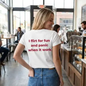 Flirt For Fun Panic Funny Dating T-Shirt 10 Lifestyle shot showing the funny dating shirt design with the quote I flirt for fun and panic when it work on the back.