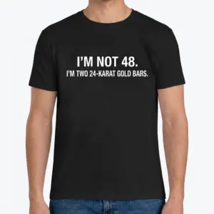 Funny 48th Birthday Gold Bars T-Shirt 9 Front view of a man wearing the funny 48th birthday shirt with white text on black fabric.