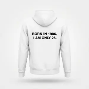 Funny Born in 1986 I Am Only 26 Birthday T-Shirt 7 Back flat lay of a hoodie featuring the text BORN IN 1986. I AM ONLY 26. across the upper back.