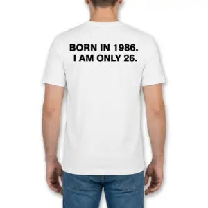 Funny Born in 1986 I Am Only 26 Birthday T-Shirt 9 Back view of a man wearing the white t-shirt printed with BORN IN 1986. I AM ONLY 26.