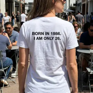 Funny Born in 1986 I Am Only 26 Birthday T-Shirt 10 Lifestyle display showcasing the back design of the humorous Born in 1986 I Am Only 26 shirt.