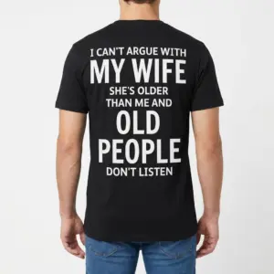 Funny Can't Argue With My Wife Husband Shirt 9 Back view of a man wearing the black funny husband shirt with the text: "I can't argue with my wife she's older than me and old people don't listen.