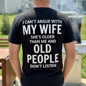 Funny Can't Argue With My Wife Husband Shirt 10 A man wearing the funny husband shirt featuring a humorous quote about arguing with his wife, shown in a casual outdoor setting.