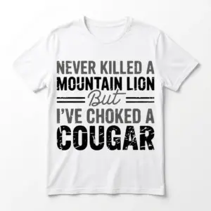 White T-shirt with 'Never killed a mountain lion but I’ve choked a cougar' text.