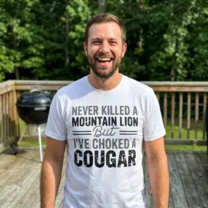 Funny Choked a Cougar Graphic T-Shirt 11 Person wearing T-shirt featuring a humorous cougar-related statement.