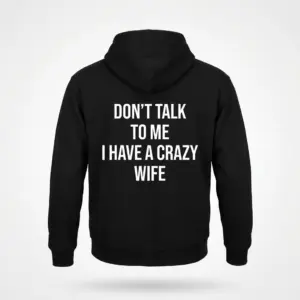 Funny Crazy Wife Husband T-Shirt 7 Back flat lay of a black hoodie featuring the Don't Talk to Me I Have a Crazy Wife humorous text design.