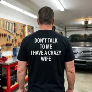 Funny Crazy Wife Husband T-Shirt 11 Lifestyle shot showcasing the Don't Talk to Me I Have a Crazy Wife shirt design from behind.