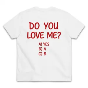 Back flat lay of a white t-shirt featuring red text reading Do You Love Me with humorous multiple choice options A Yes, B A, and C B.