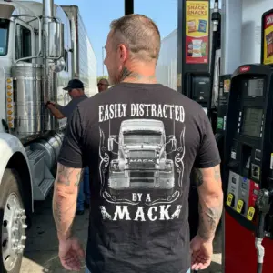 Funny Easily Distracted By A Mack Truck T-Shirt 10 The humorous 'Easily Distracted By A Mack' design, perfect for truck enthusiasts, featuring a detailed semi-truck graphic.