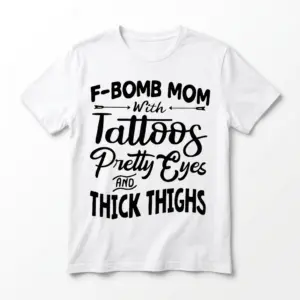 White t-shirt with 'F-Bomb Mom, Tattoos, Pretty Eyes, Thick Thighs' graphic text.