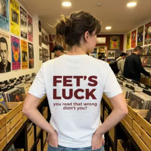 Funny Fet's Luck Mind Trick T-Shirt 11 Lifestyle showcase displaying the back graphic reading FET'S LUCK you read that wrong didn't you.