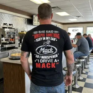 Funny "I Drive A Mack" Trucker T-Shirt 11 Humorous black Mack Trucker T-shirt featuring the bold bulldog logo and "I Drive A Mack" text, suitable for everyday wear.
