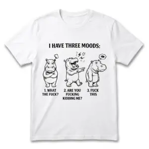 Flat lay of a white t-shirt featuring three cartoon hippos with funny sarcastic mood captions.