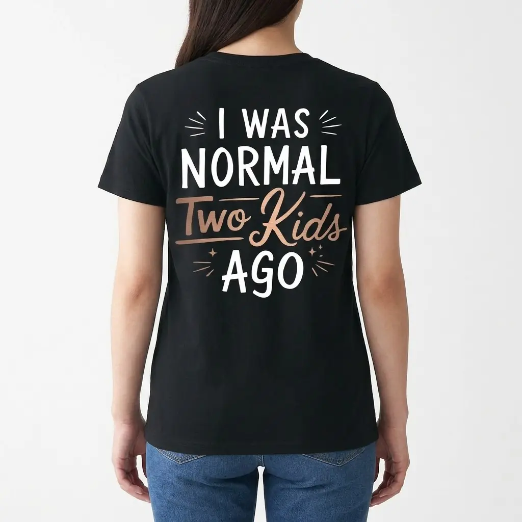 Back view of a woman wearing the 'I Was Normal Two Kids Ago' graphic shirt.