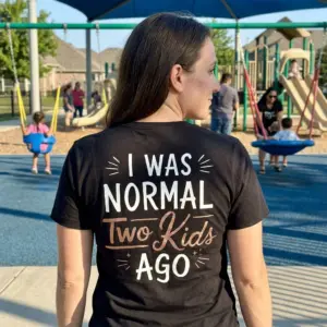 Funny I Was Normal Two Kids Ago T-Shirt 10 Lifestyle setting showing the back design of the 'I Was Normal Two Kids Ago' shirt.