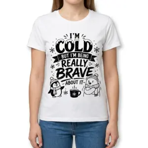 Funny 'I'm Cold But Brave' Winter T-Shirt 9 Woman wearing the white t-shirt with the funny winter graphic: "I'm Cold But I'm Being Really Brave About It", a penguin, and a polar bear.