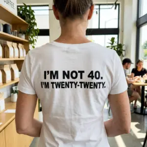 Funny I'm Not 40 Twenty-Twenty Birthday T-Shirt 11 Close-up back view of a 40th birthday gag t-shirt showing the text I'M NOT 40. I'M TWENTY-TWENTY.
