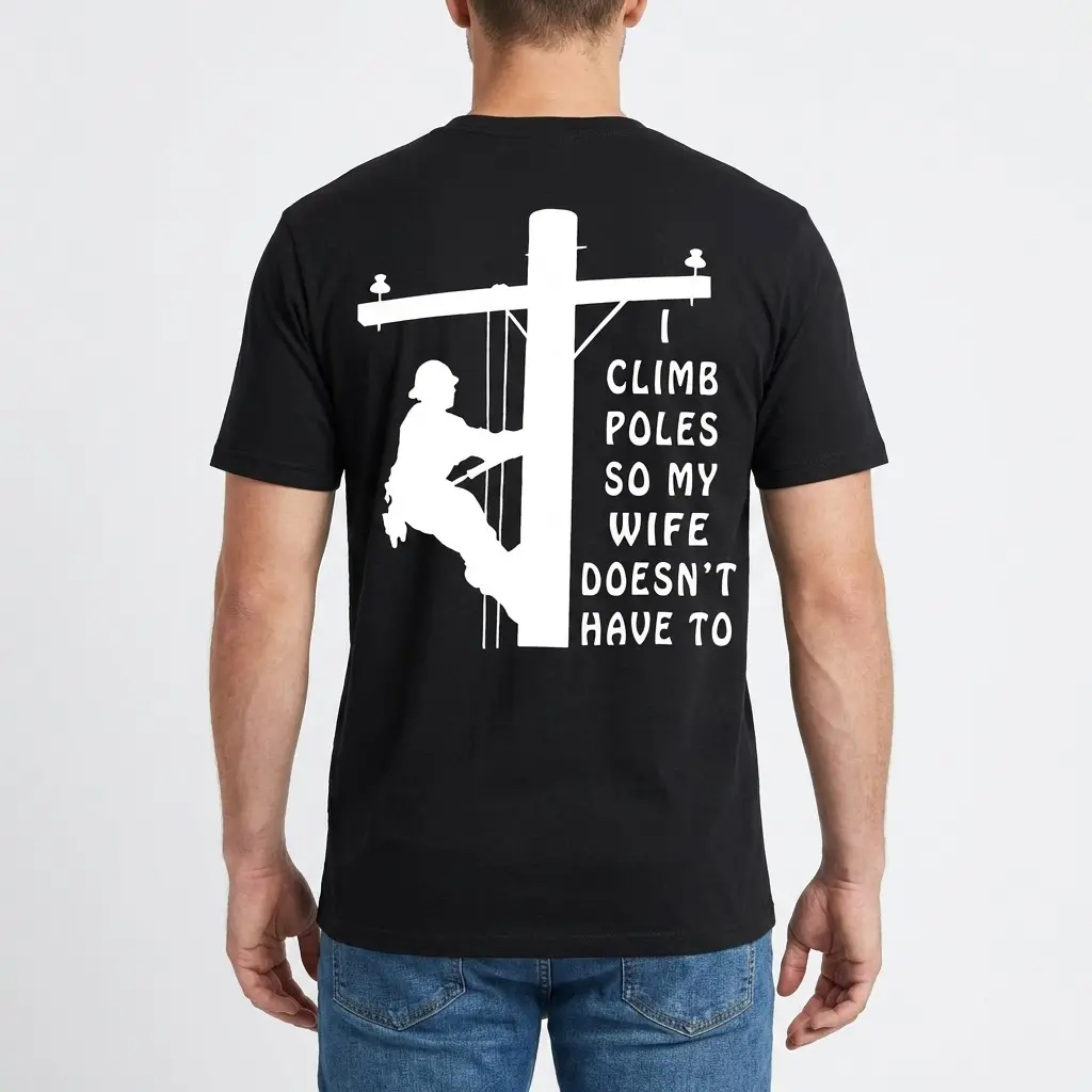 Back view of a man wearing the black t-shirt featuring the lineman pole climbing graphic.