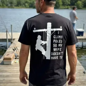 Funny Lineman Husband Climb Poles T-Shirt 10 Lifestyle setting displaying the back design of the funny lineman shirt.