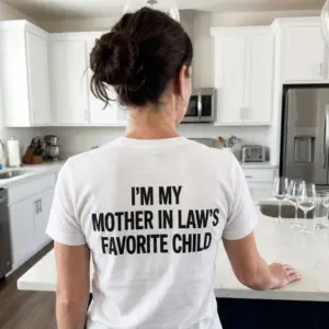 Funny Mother-in-Law's Favorite Child T-Shirt 11 Casual lifestyle scene showcasing the humorous mother-in-law favorite child graphic apparel.