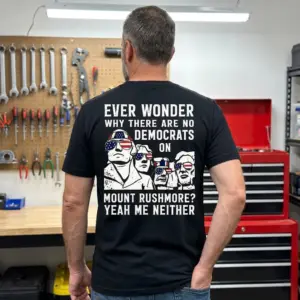 Funny Mount Rushmore Political Graphic T-Shirt 11 Casual lifestyle setting displaying the patriotic Mount Rushmore design on apparel.