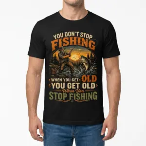 Funny Old Fisherman Never Stop Fishing T-Shirt 8 Man models the black t-shirt, highlighting the funny fishing design of an old angler and a bass, viewed from the front.