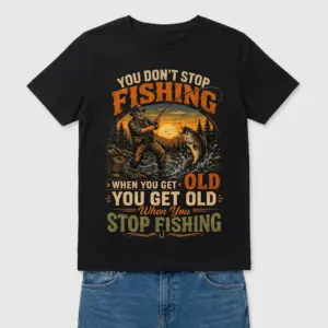 Funny Old Fisherman Never Stop Fishing T-Shirt 9 Woman wearing the black t-shirt, showcasing the "You Get Old When You Stop Fishing" design with an outdoor scene, front view.