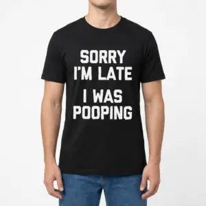 Funny Sorry Im Late I Was Pooping T-Shirt 9 Front view of a man wearing the black graphic tee printed with Sorry I'm Late I Was Pooping.