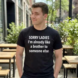 Funny Sorry Ladies Friendzone T-Shirt 10 A young man casually wearing the black t-shirt with the humorous quote about being like a brother to someone else.