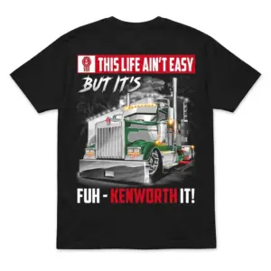 Black t-shirt flatlay showing the back with a green and silver Kenworth truck design and "This Life Ain't Easy But It's Fuh-Kenworth It!" text.