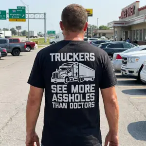Funny Truckers See More Graphic T-Shirt 11 Casual lifestyle setting showing the humorous trucker design on a black shirt.