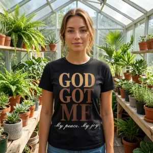 God Got Me Retro Christian Faith T-Shirt 11 Model wearing black 'God Got Me' faith T-shirt.