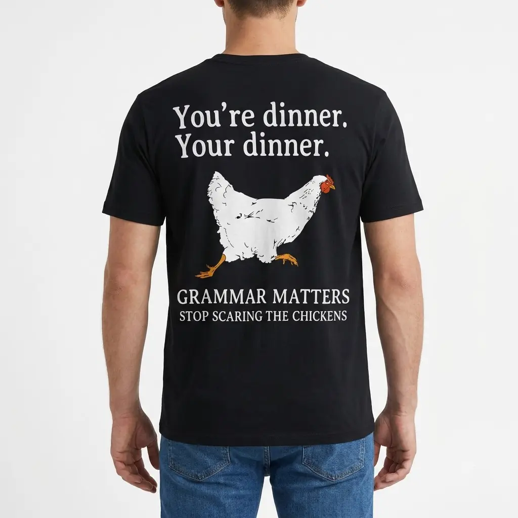 Grammar Matters Chicken Pun T-Shirt 4 Back view of a man wearing a black t-shirt that highlights a chicken grammar pun.