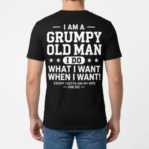 Grumpy Old Man Funny T-Shirt for Husbands 9 Male model wearing a black t-shirt from behind, showcasing humorous marriage-related text.