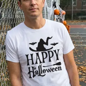 Happy Halloween Witch Hat T-Shirt 11 Person enjoying a festive moment wearing the 'Happy Halloween' tee with playful graphics.