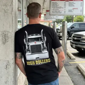 High Rollers Chrome Truck T-Shirt 11 T-shirt with chrome truck graphic worn by model in outdoor setting.