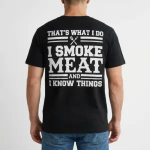 I Smoke Meat and I Know Things BBQ T-Shirt 9 A man wearing the black funny BBQ shirt, showing the back design that reads "That's What I Do I Smoke Meat And I Know Things" in white print.