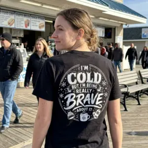 I'm Cold But Really Brave Winter Sarcastic T-Shirt 10 A black t-shirt with the "I'M COLD BUT I'M BEING REALLY BRAVE ABOUT IT" design, conveying relatable cold-weather humor for a cozy vibe.