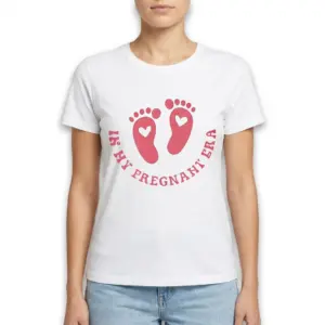 In My Pregnant Era Footprint T-Shirt 9 Side view of white t-shirt showing pink design, 'In My Pregnant Era'.