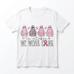 Breast Cancer Awareness Ghost Shirt ? white flat lay tee showing four pink, leopard, and checkered ghosts above In October We Wear Pink